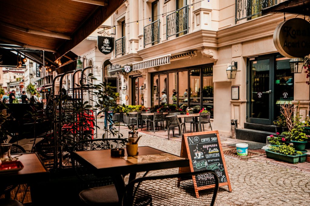 solo travel vs group tours elegant european cafe street