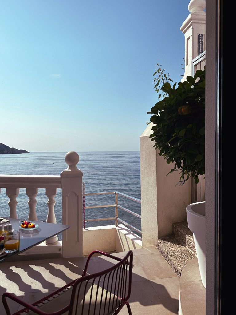 why solo travel over 50 hits different slow morning breakfast on luxury mediterranean balcony view