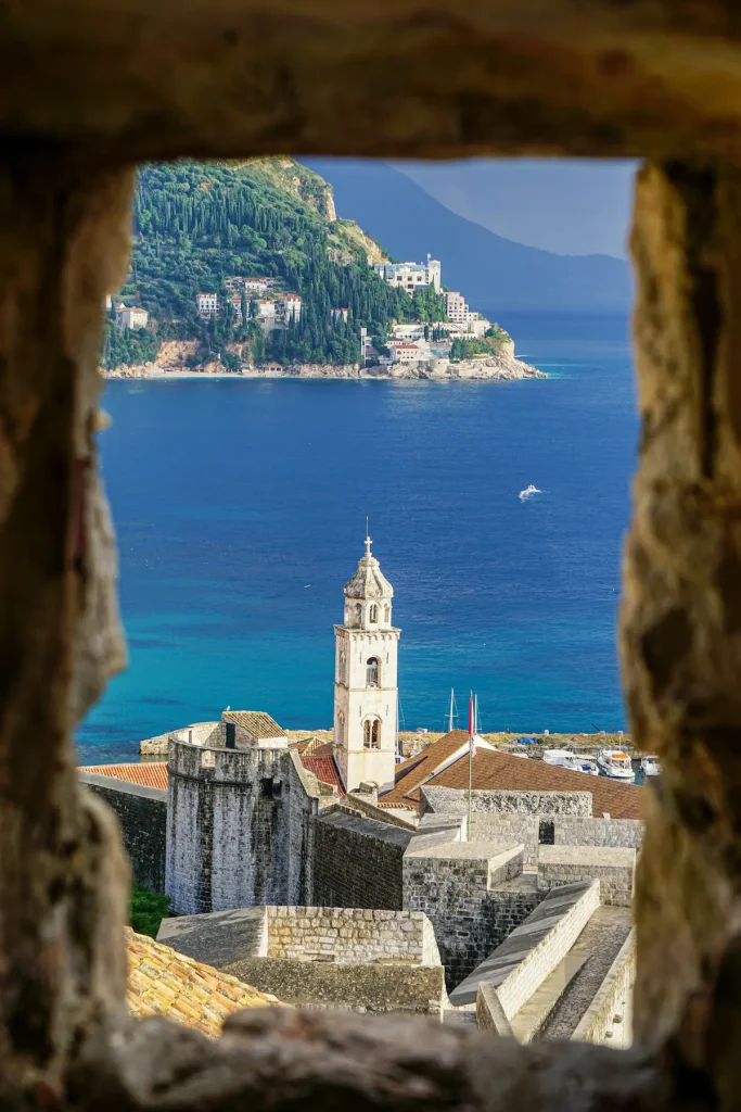 The terracotta rooftops of Dubrovnik's old town above the blue Adriatic Sea, illustrating safe and elegant Croatia solo travel for women over 50.