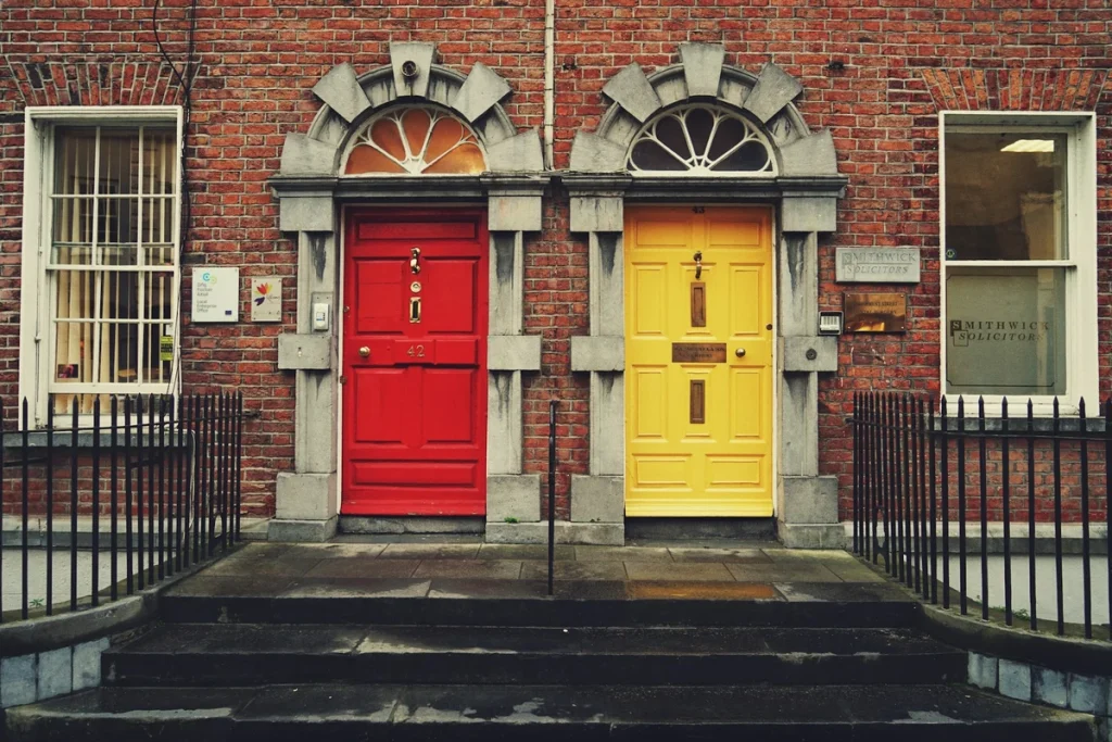 Colorful Georgian doorways on a Dublin street, illustrating safe and elegant Dublin solo travel for women over 50.