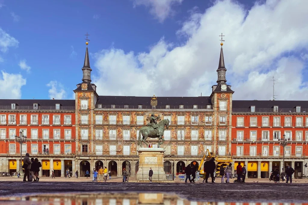 The grand Plaza Mayor in golden light, Madrid, illustrating safe and elegant Madrid solo travel for women over 50.