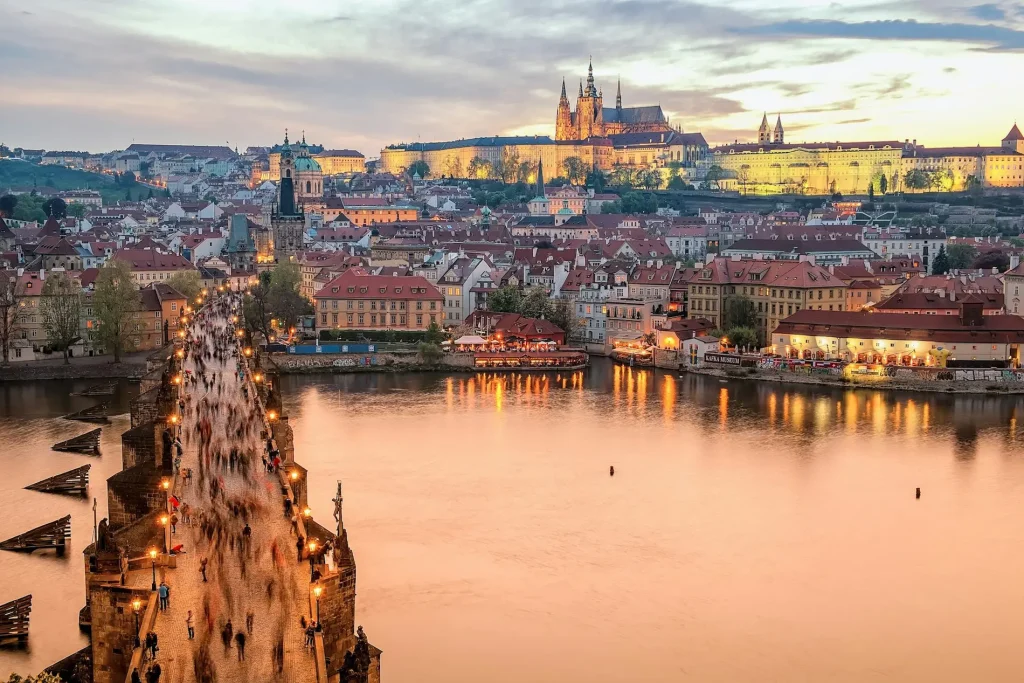 Charles Bridge and Prague Castle above the Vltava river at dawn, illustrating safe and elegant Prague solo travel for women over 50.