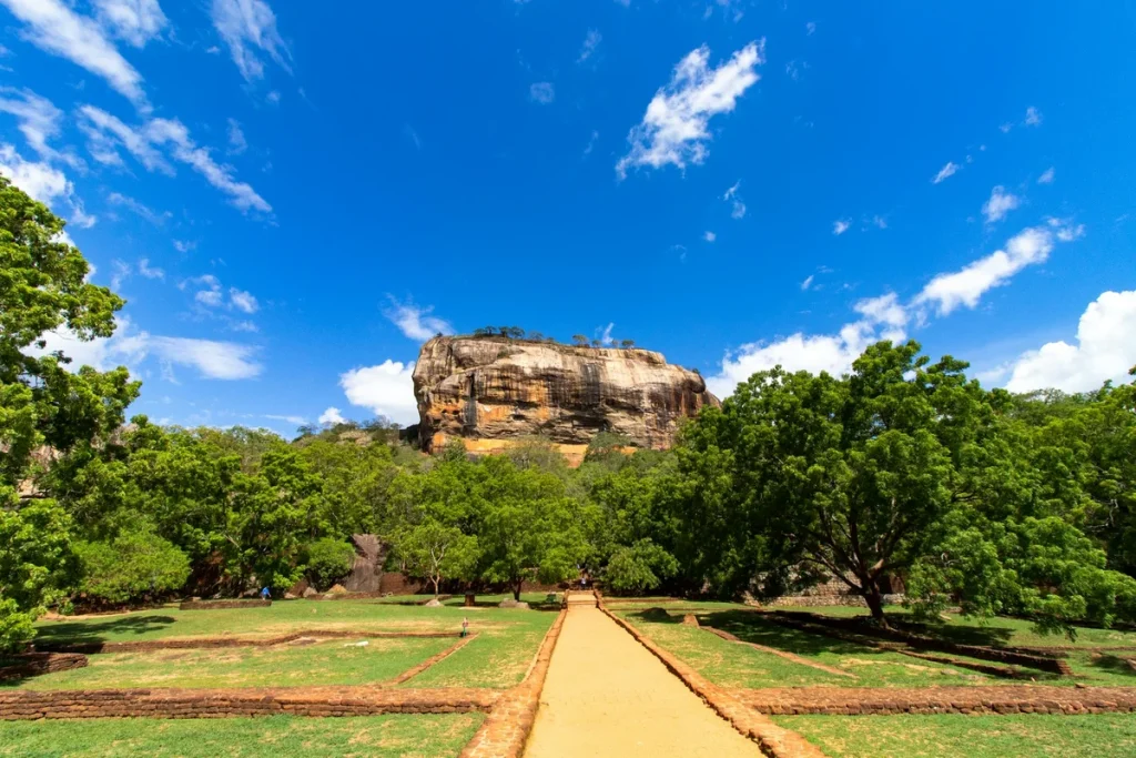 The Sigiriya rock fortress rising above green jungle, Sri Lanka, illustrating safe and elegant solo travel in Sri Lanka for women over 50.