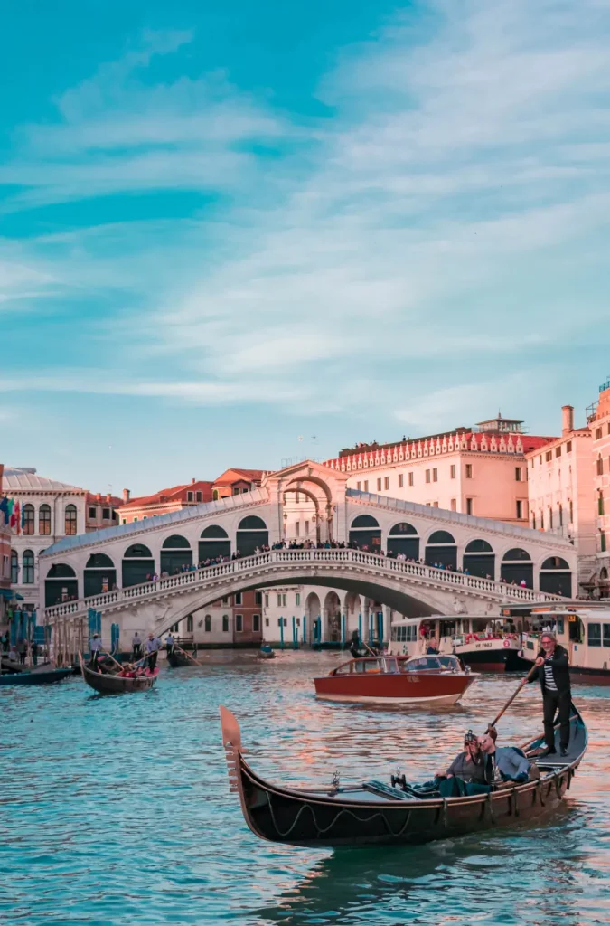 Gondolas on the Grand Canal before a Venetian palazzo, illustrating safe and elegant Venice solo travel for women over 50.