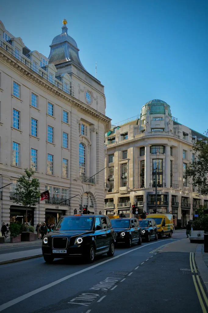 Elegant white townhouses on a quiet garden square in central London, illustrating where to stay in London for women over 50.