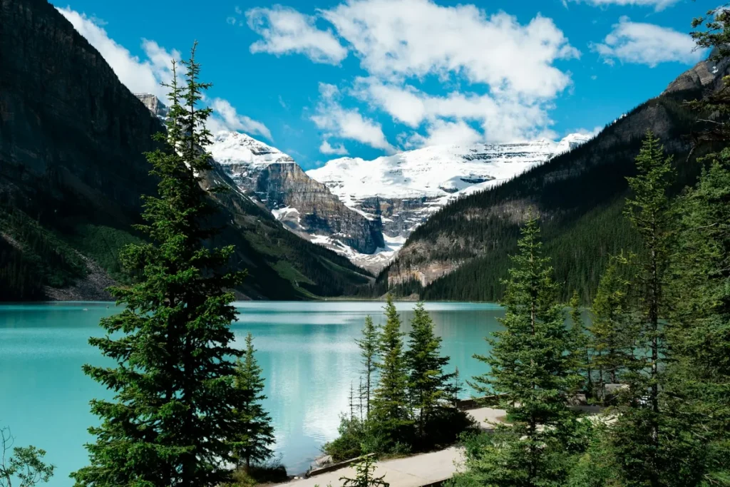 banff solo travel — turquoise Lake Louise beneath its glacier in the Canadian Rockies, Alberta, Canada